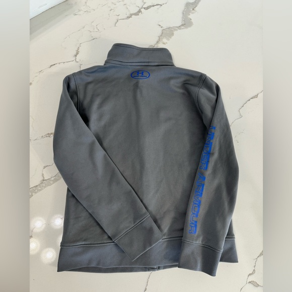 Youth Under Armour full zip up top size small, dark gray with blue lettering. - Picture 2 of 3